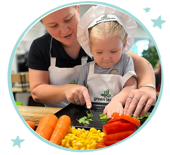Inside Out Program - Educator supporting child in culinary experience