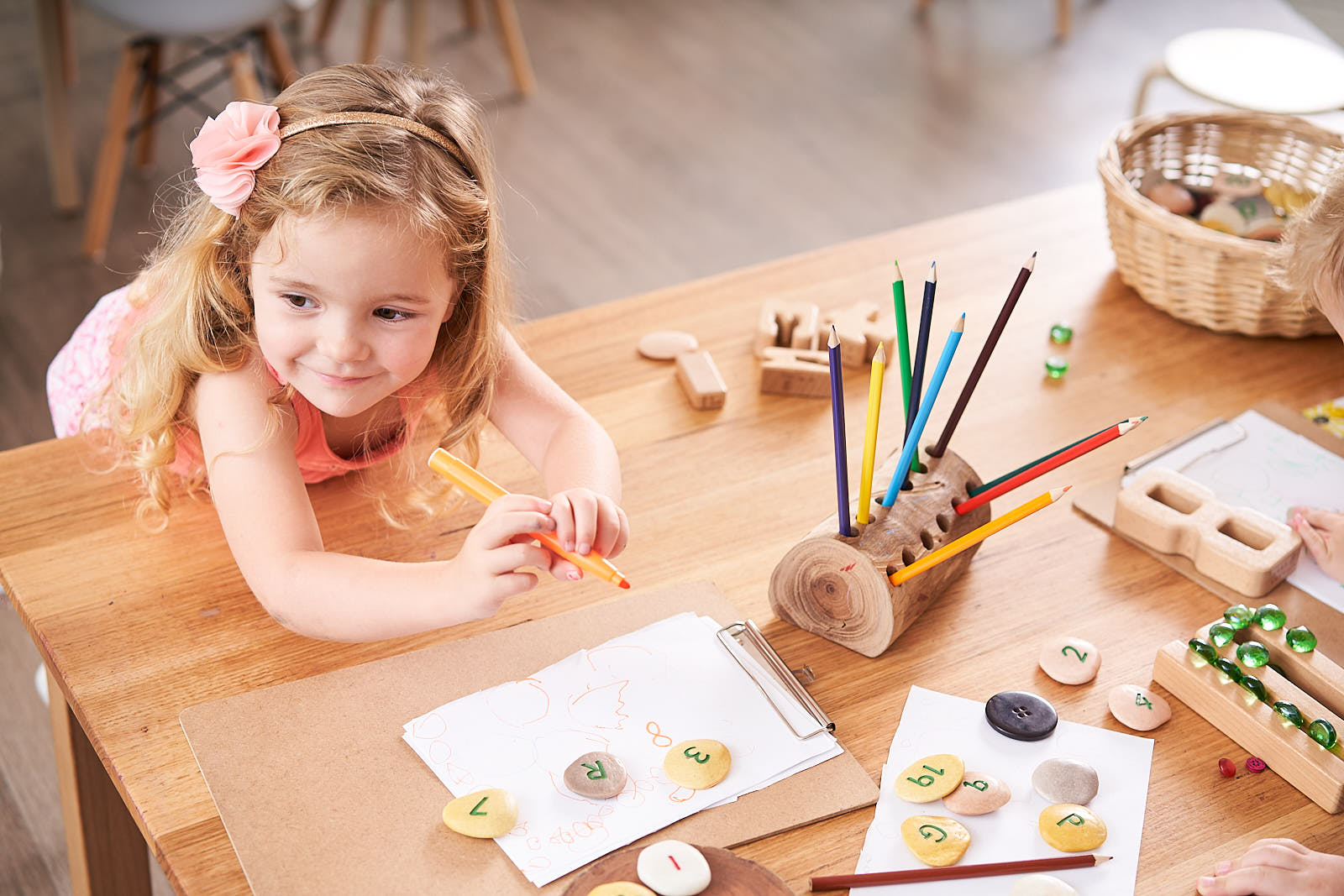 play-based learning with green leaves early learning