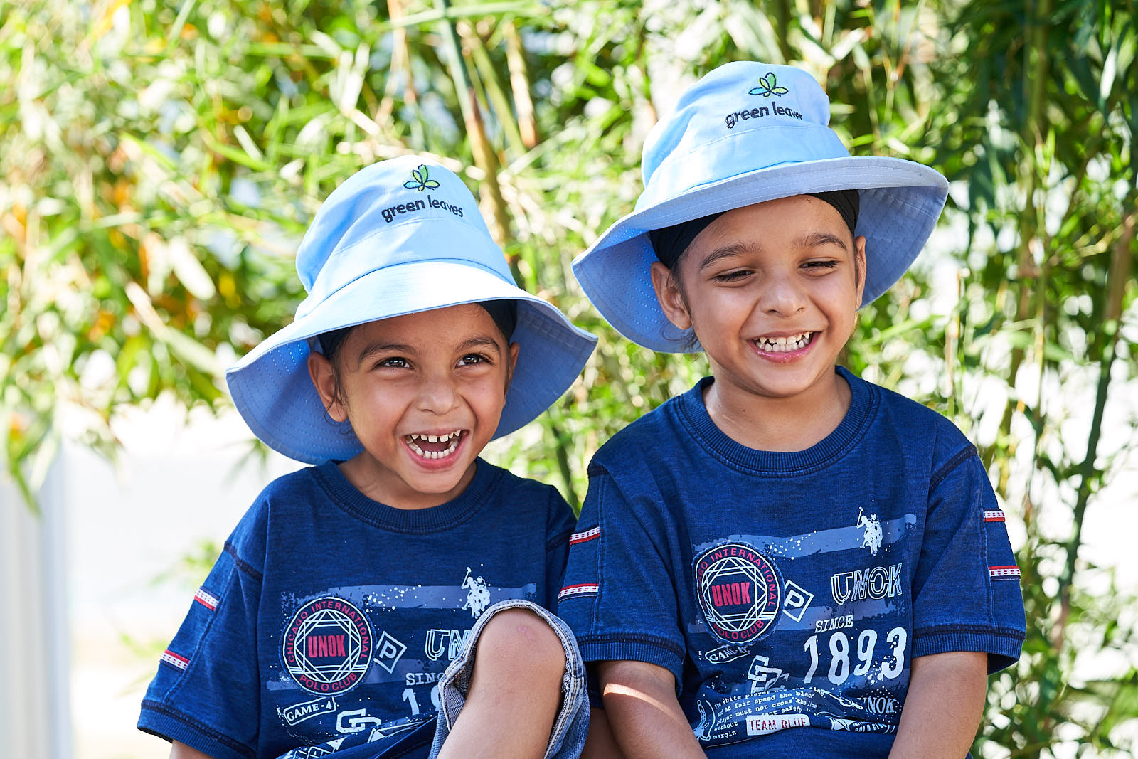 happy green leaves children at daycare centre enjoying the outdoor play spaces