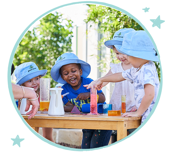 green leaves daycare pre-kindergarten children playing outdoors steam experiment