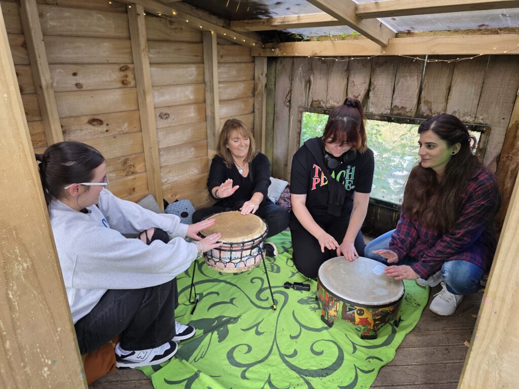 Educators participating in activity with musical instruments