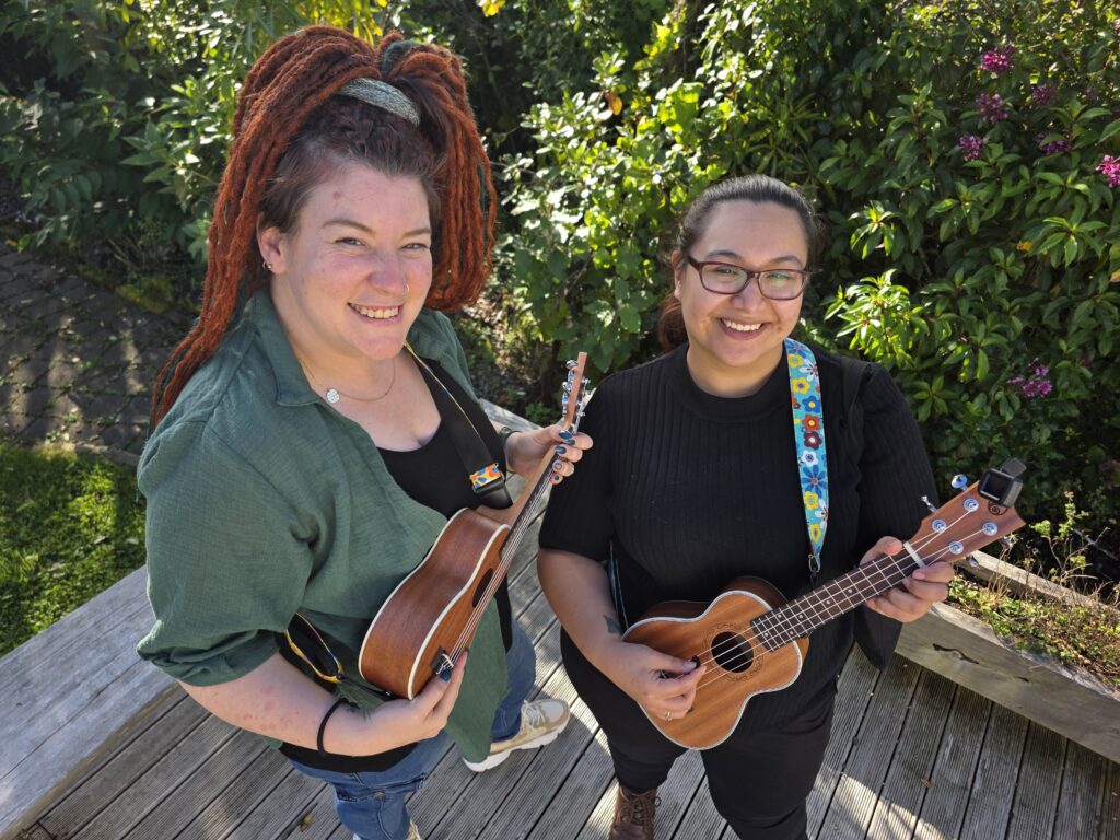 Educators participating in activity with musical instruments and guitars